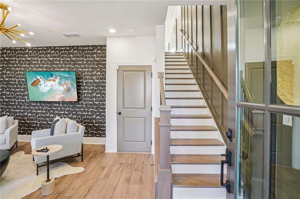 From the main level going up to open concept Kitchen and Living Room . Not the actual building or unit