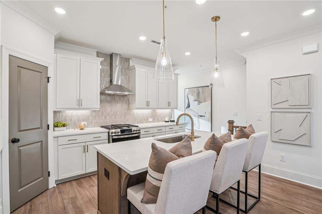 Spacious Kitchen with quartz countertop  island , eat in breakfast . Not the actual building or unit