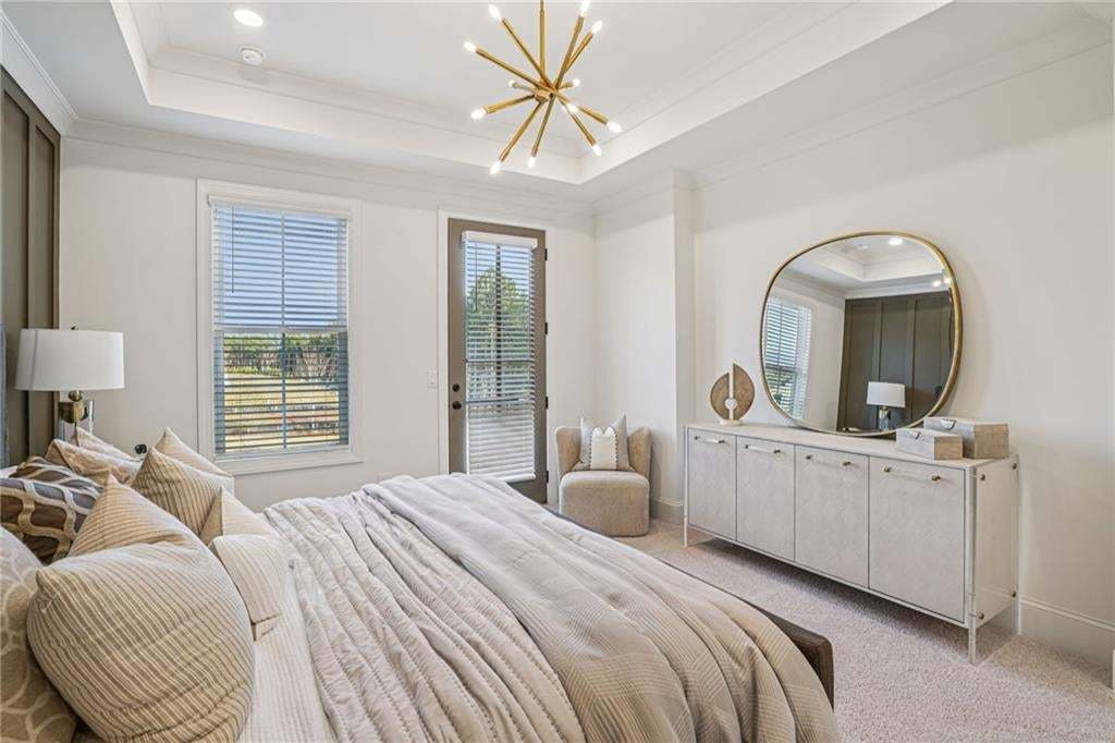 Owner's Bedroom with tray ceilings and a ROmeo & Juliet Balcony . not the actual unit or building