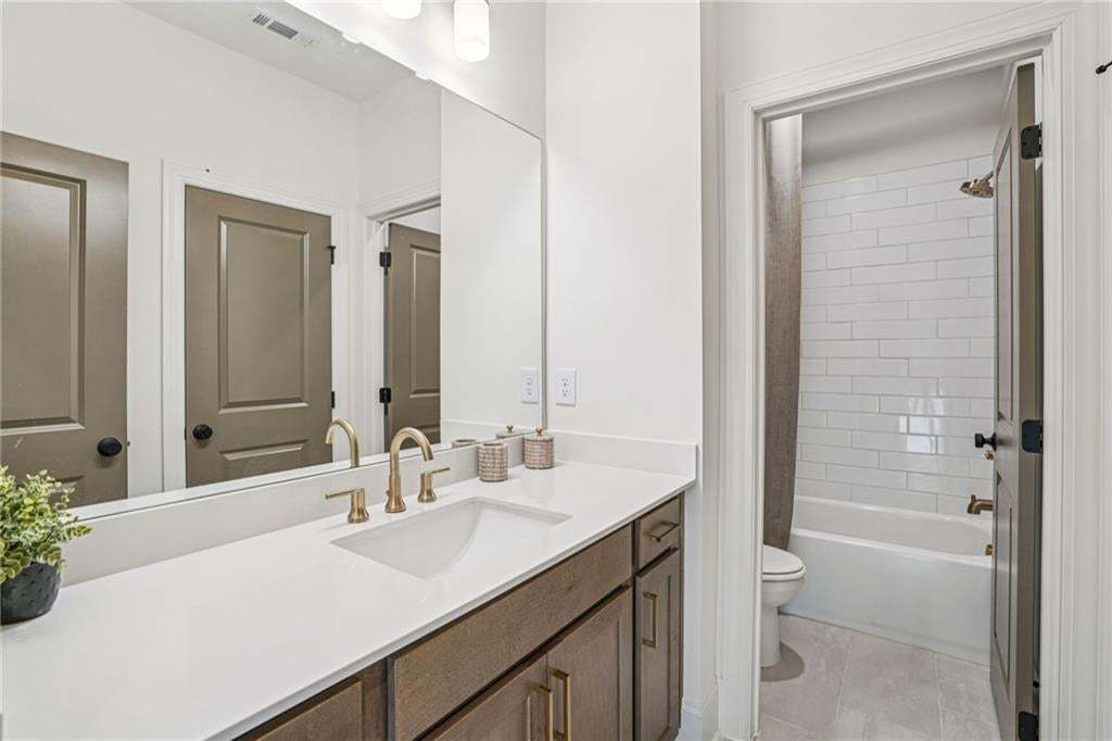 Dual vanity with a walk in frameless shower . not the actual unit or building