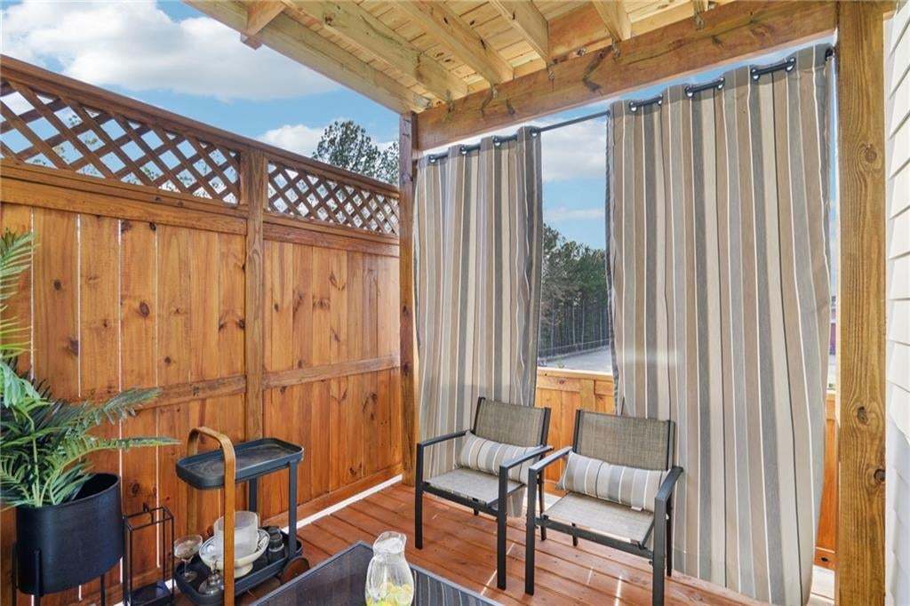 Wooden Deck coming out from the Office behind the Kitchen not the actual unit or building