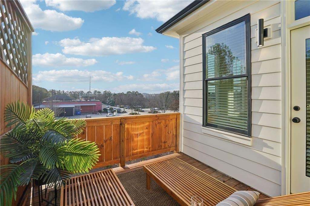 Upper Wooden Deck coming out from the 2nd Guest Bedroom not the actual unit or building