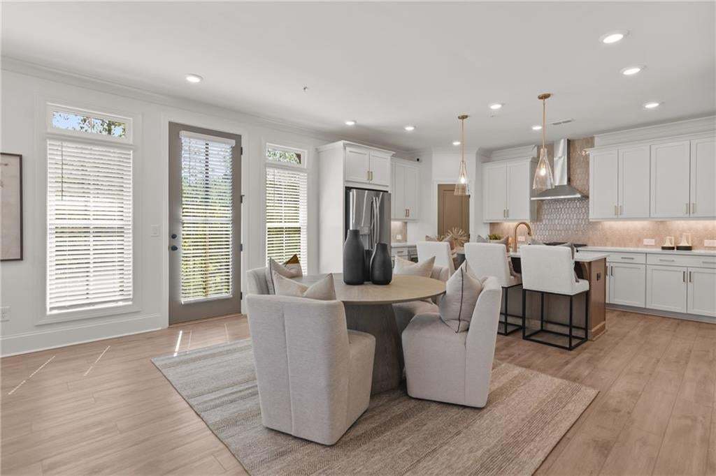 Kitchen open space concept featuring GE Stainless Steel Appliances 42" cabinets and quartz countertop. *Photos are not the actual unit. Decorated model home photos used.