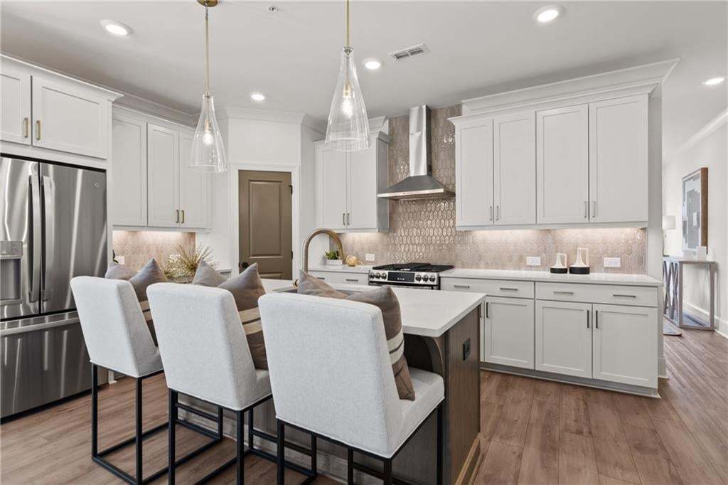 42'' Cabinets, quartz countertop and GE Stainless Steel Appliances. *Photos are not the actual unit. Decorated model home photos used.