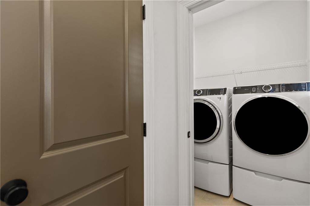 Spacious Laundry room on second floor. *Photos are not the actual unit. Decorated model home photos used.