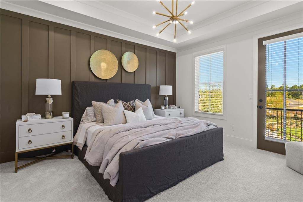 Owner suite with tray ceilings, additional LED lights with private Romeo & Juliet Balcony. *Photos are not the actual unit. Decorated model home photos used.