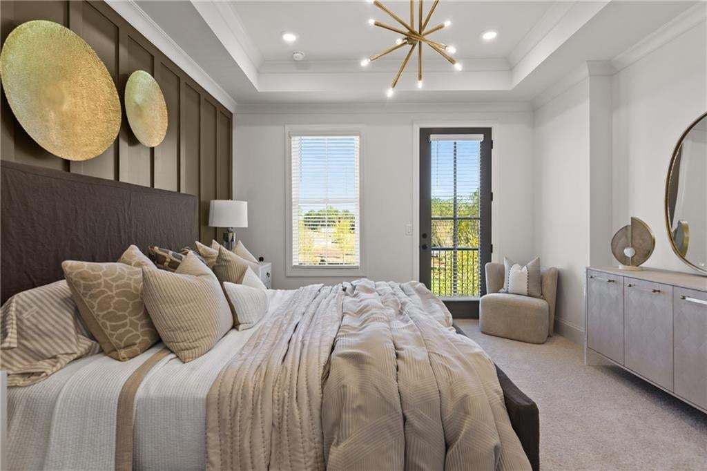 Owner bedroom with tray ceilings and Romeo & Juliet Balcony. *Photos are not the actual unit. Decorated model home photos used.