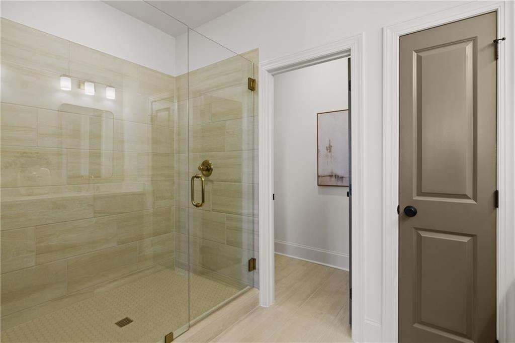 Owner bathroom with large walk-in shower and separate water closet. *Photos are not the actual unit. Decorated model home photos used.