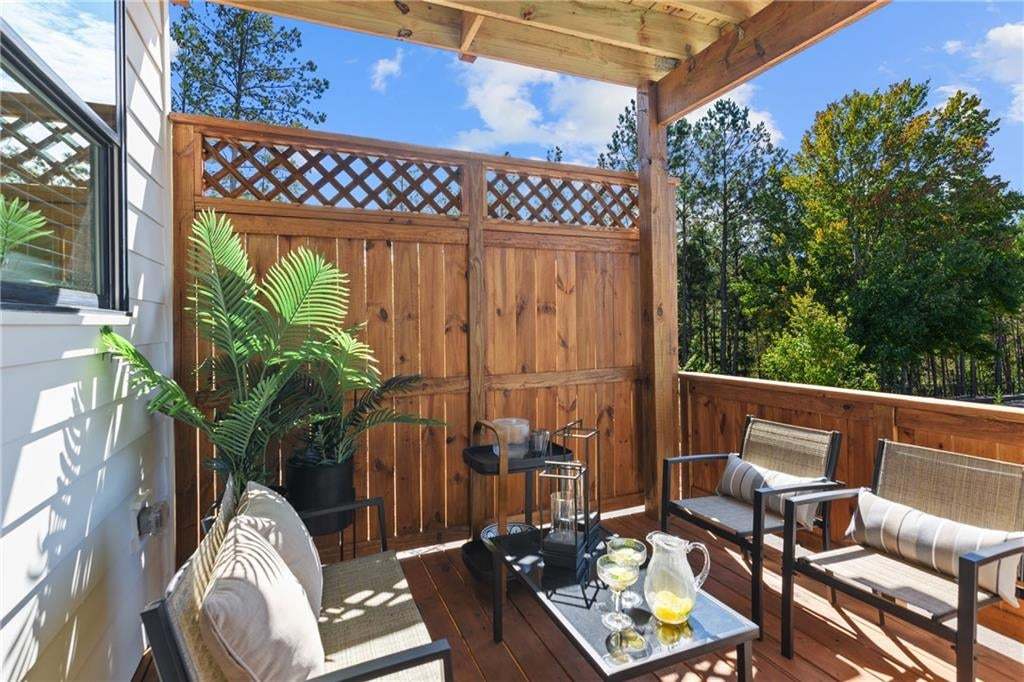 Private wooden deck off second floor sunroom. *Photos are not the actual unit. Decorated model home photos used.
