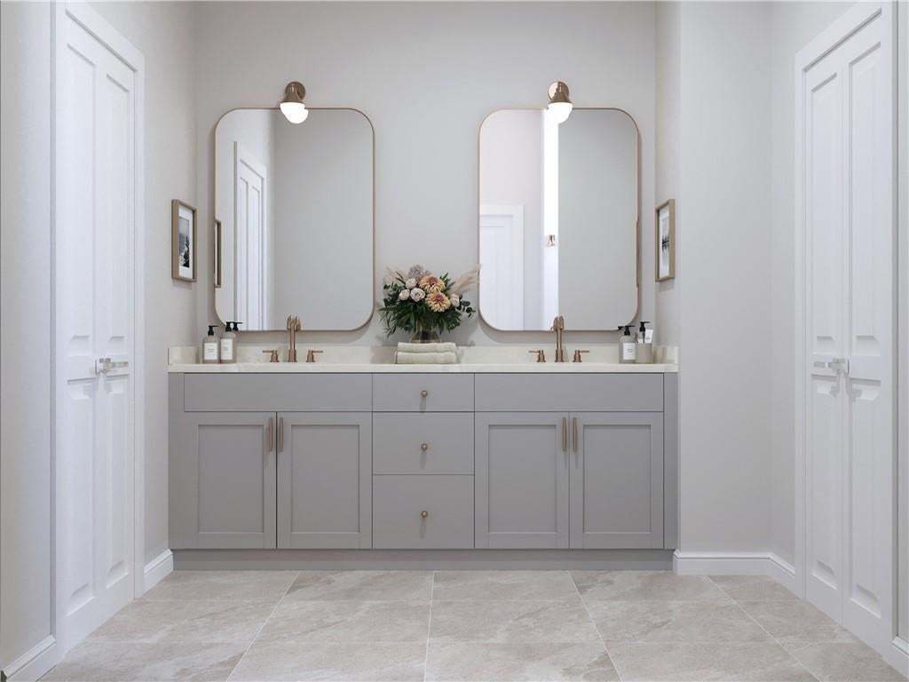 Gorgeous primary bathroom located on main floor. Photo not of actual home but of a previously built TPG home.