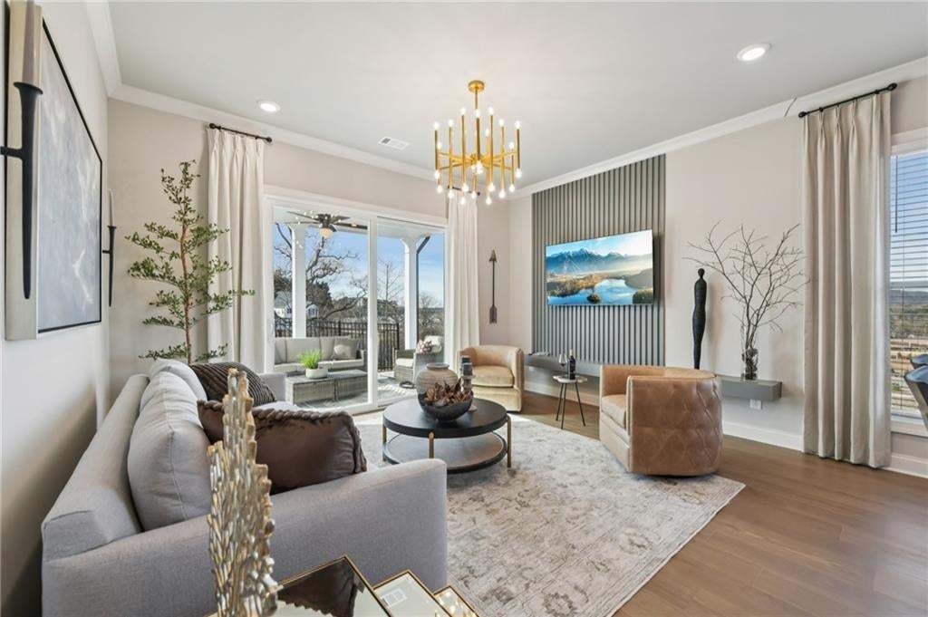 You will love the space in this family room...opening onto the covered patio area.  Photo not of actual home but for representation purposes only.
