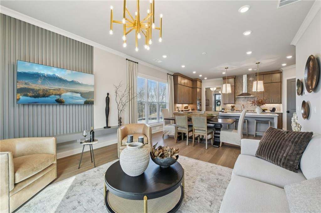 Open to the kitchen and dining area for that open concept feel.  Photo not of actual home but for representation purposes only.