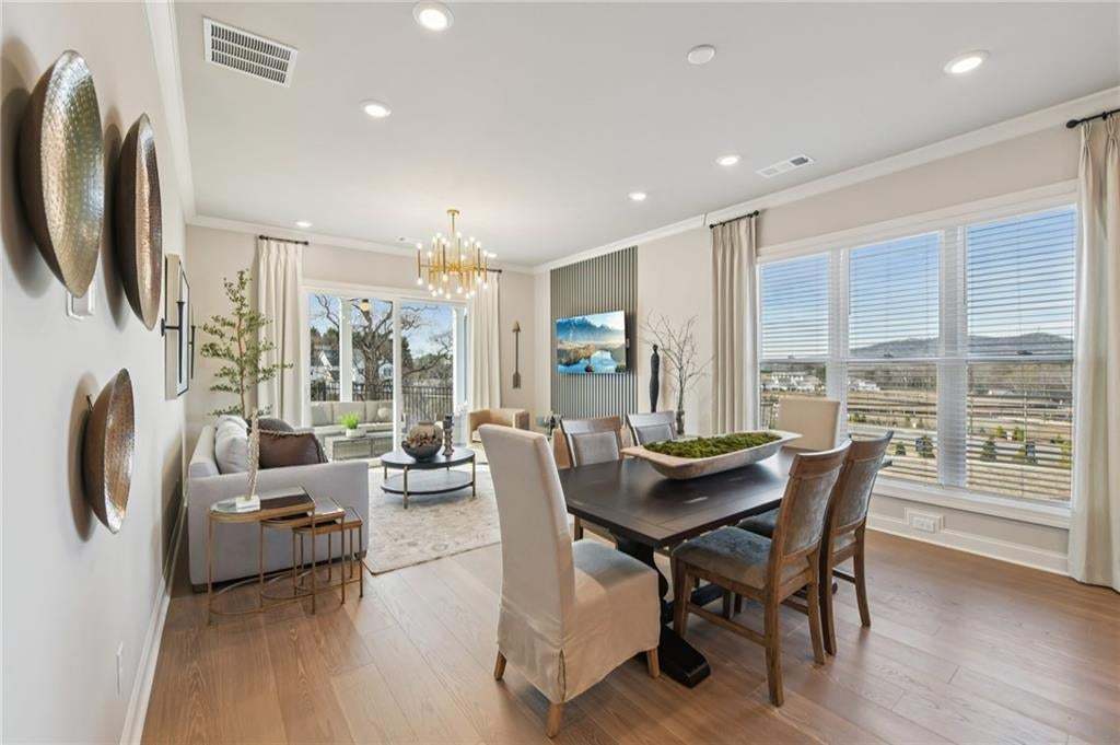 Dining space can hold large table for gatherings.  Photo not of actual home but for representation purposes only.