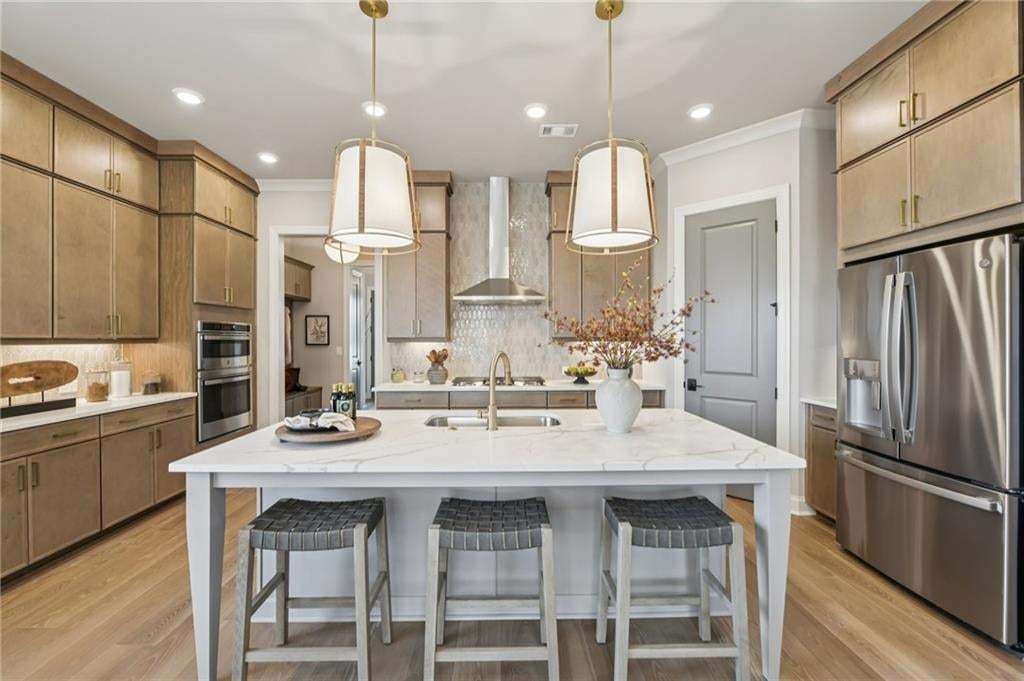 Large island great for prep work or informal dining.  Photo not of actual home but for representation purposes only.