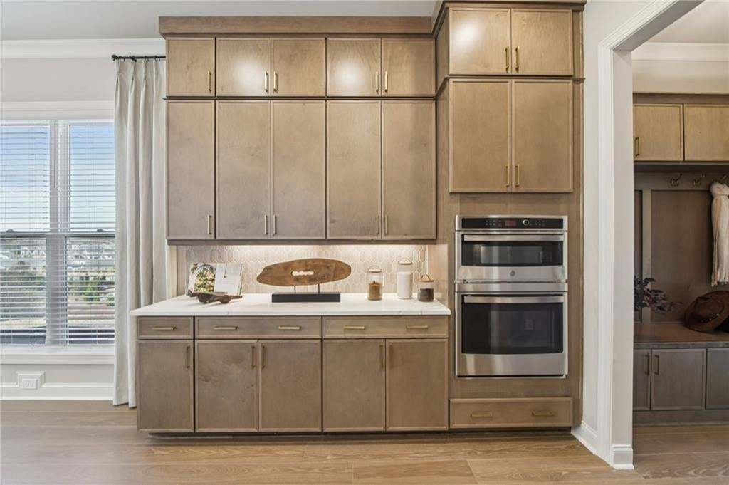 Under cabinet lighting, soft touch drawers and doors just a few of the standards with a TPG home. Photo not of actual home but for representation purposes only.