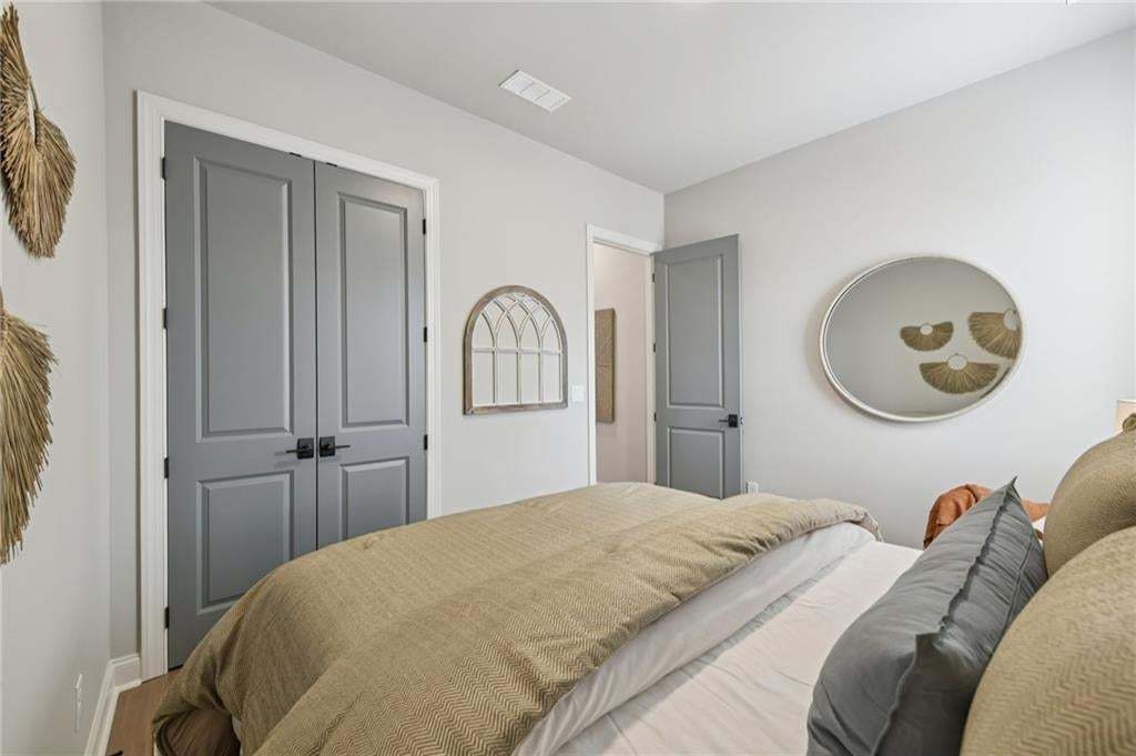 Spacious guest room on main floor. Photo not of actual home but for representation purposes only.