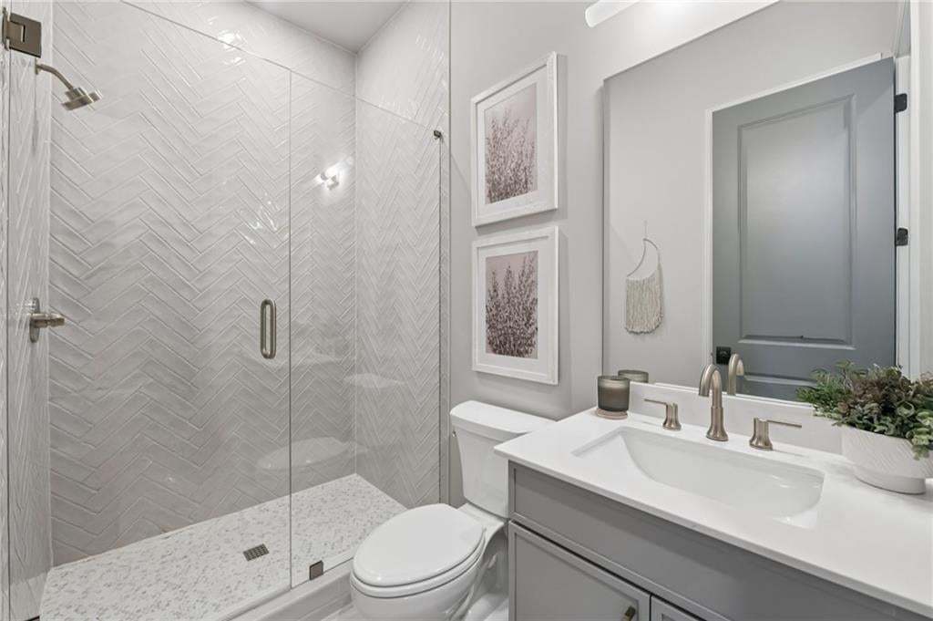 Main floor bathroom. Photo not of actual home but for representation purposes only.
