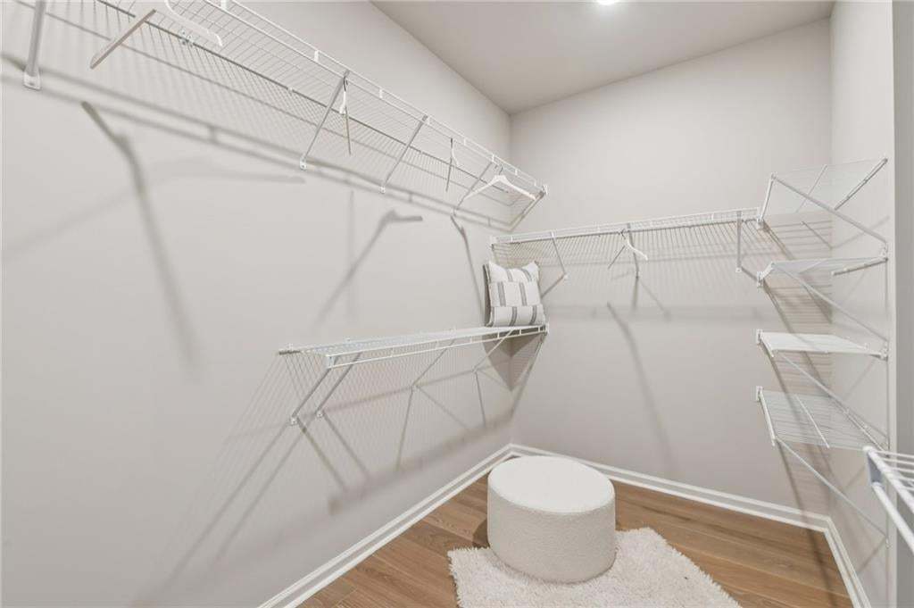 Large primary closet.  Photo not of actual home but for representation purposes only.