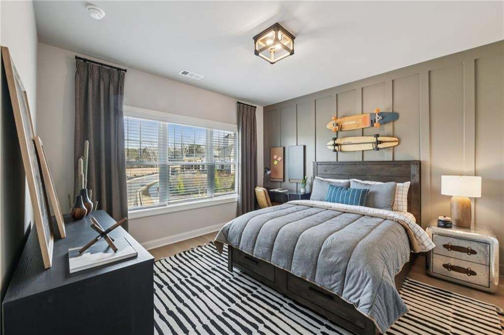 Secondary bedroom on second floor. Photo not of actual home but for representation purposes only.