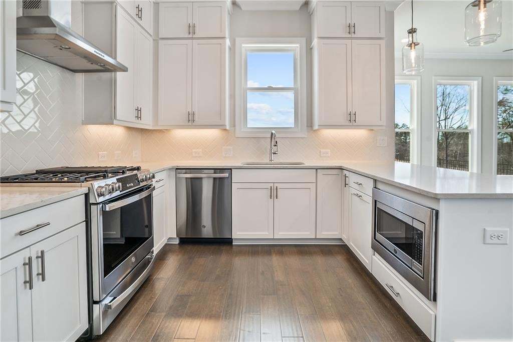 Spacious and well lit kitchen. Plenty of cabinet and storage space.  Photo not of actual home but a previously built TPG home.