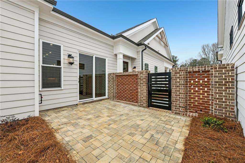 Paver patio with fenced courtyard! HOA maintains all landscaping and lawn care- what are you waiting for!