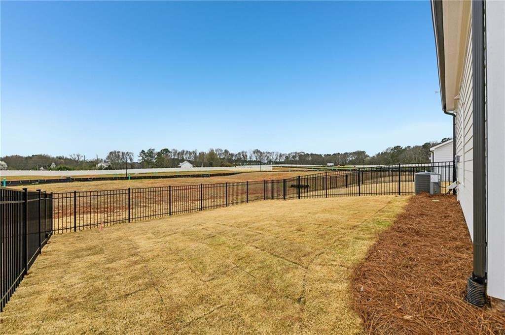 View of fenced backyard