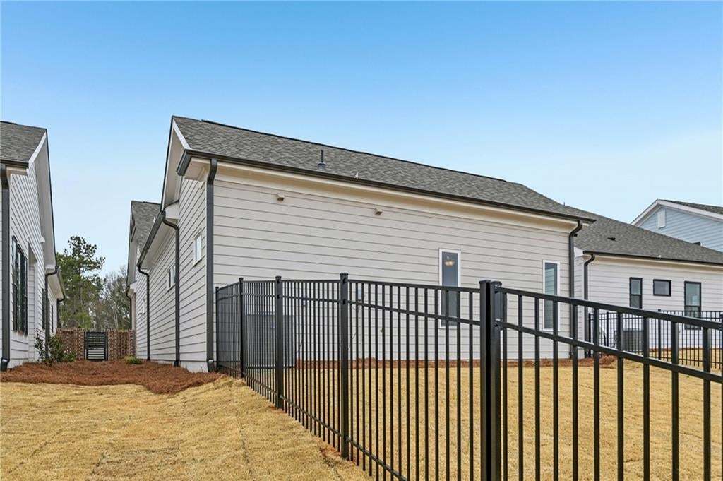 View of property exterior featuring a shingled roof