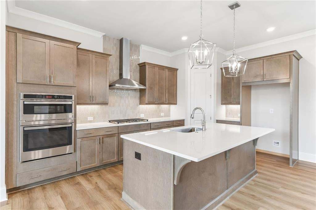 This gorgeous kitchen features GE appliances, quartz countertops, under cabinet lighting just to name a few of these gorgeous finishes.