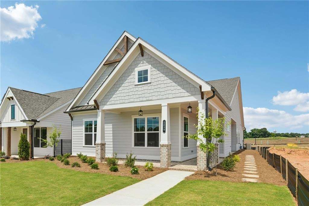 This lovely craftsman style home is the McDaniel...all ranch living! Come see today at the Aberdeen in Hoschton.