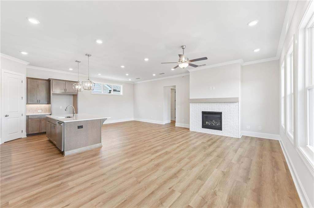 This home has beautifully stained cabinets with soft touch throughout the home on drawers and all doors!! The fireplace is perfect for cozy evenings!