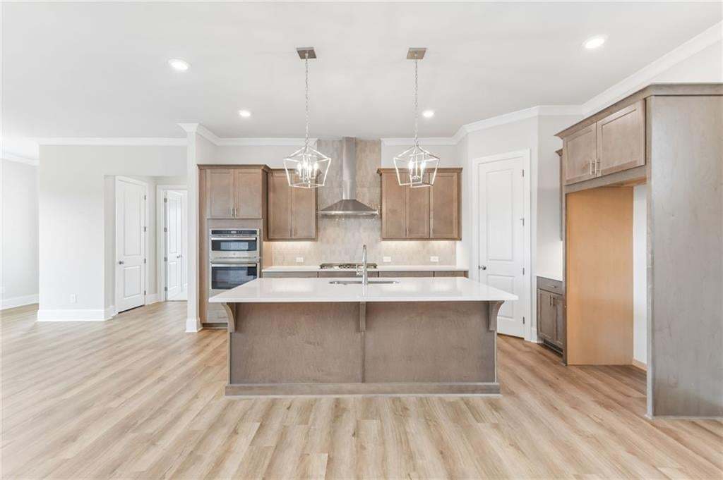 Open concept living with gourmet kitchen for easy and quick meal prep!!