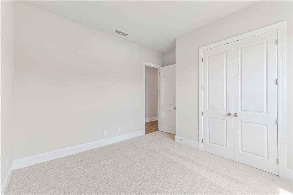 Secondary bedroom located on main floor with large closet for extra storage!