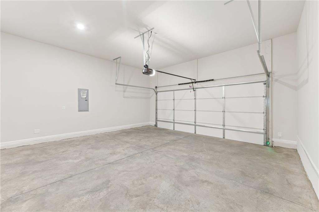 Spacious 2 car garage, with remote and door openers.  Tankless water heater will be found in the garage as well. Garage is located in rear of home