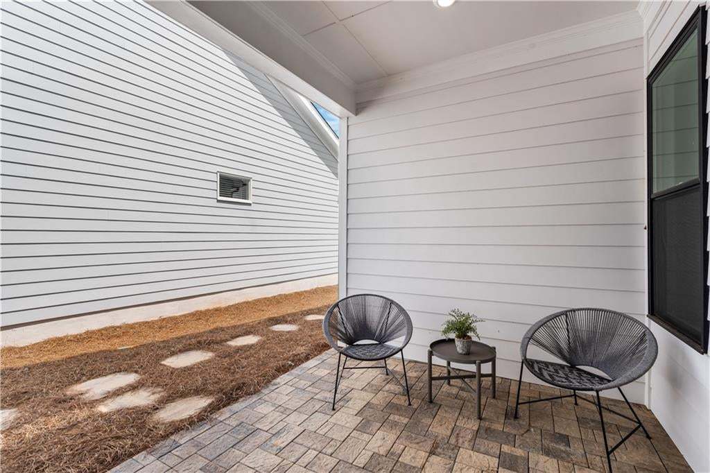 Upgraded black trimmed windows, pavers on the patio for entertaining.