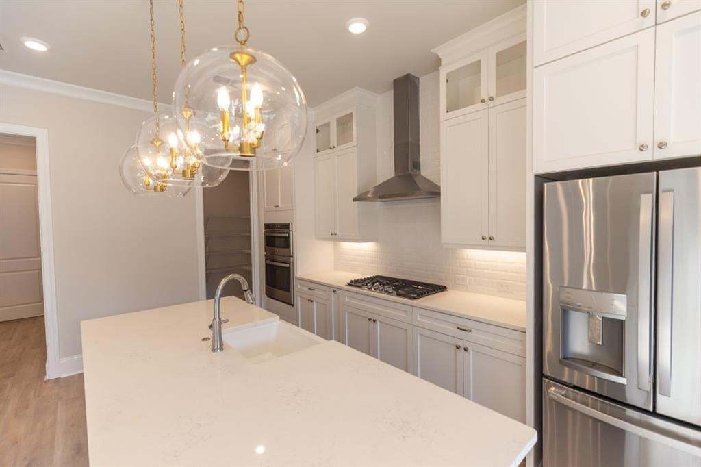 This stunning kitchen in the Hampton provides ample storage and counter space.  Photo is for representation purposes only, not of actual home but a previously built home by The Providence group.