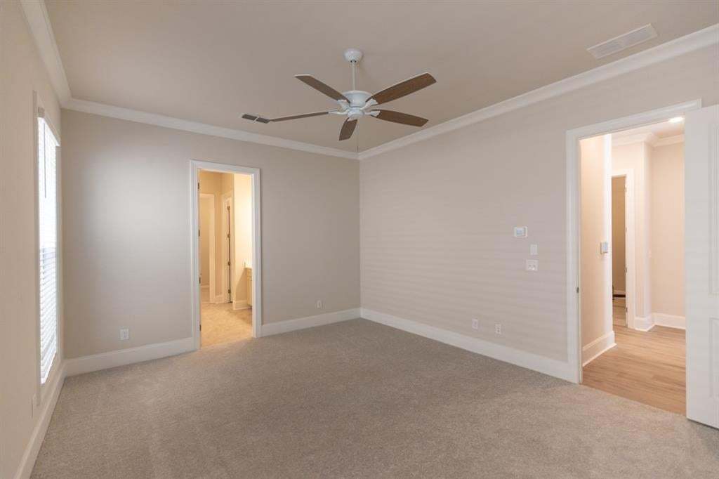 Primary bedroom on main floor attached to a spa like primary bathroom. Pick out your finishes, like hardwood floors in the bedroom, sure, no problem.  Photo is for representation purposes only, not of actual home but a previously built home by The Provid