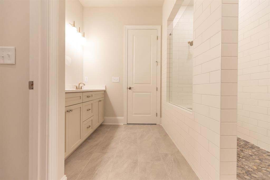 Beautiful primary bathroom.  Come see the Aberdeen located near downtown Hoschton.   Photo is for representation purposes only, not of actual home but a previously built home by The Providence group.