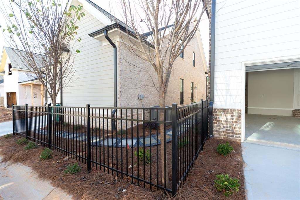 The Arden collection features garages and driveways in the back of the home.  Each home has it's own private fenced courtyard.  Photo is for representation purposes only, not of actual home but a previously built home by The Providence group.