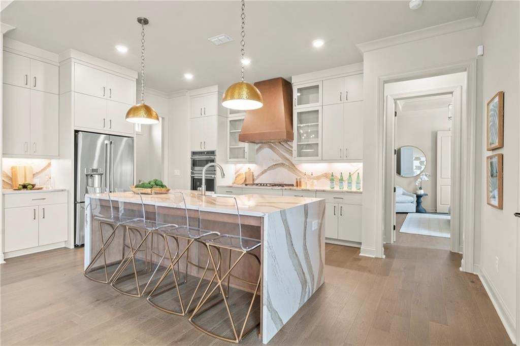 Great kitchen layout, quartz countertops; under cabinet lighting, soft touch drawers and doors...GE appliances. Photo not of actual home but for representation purposes only.