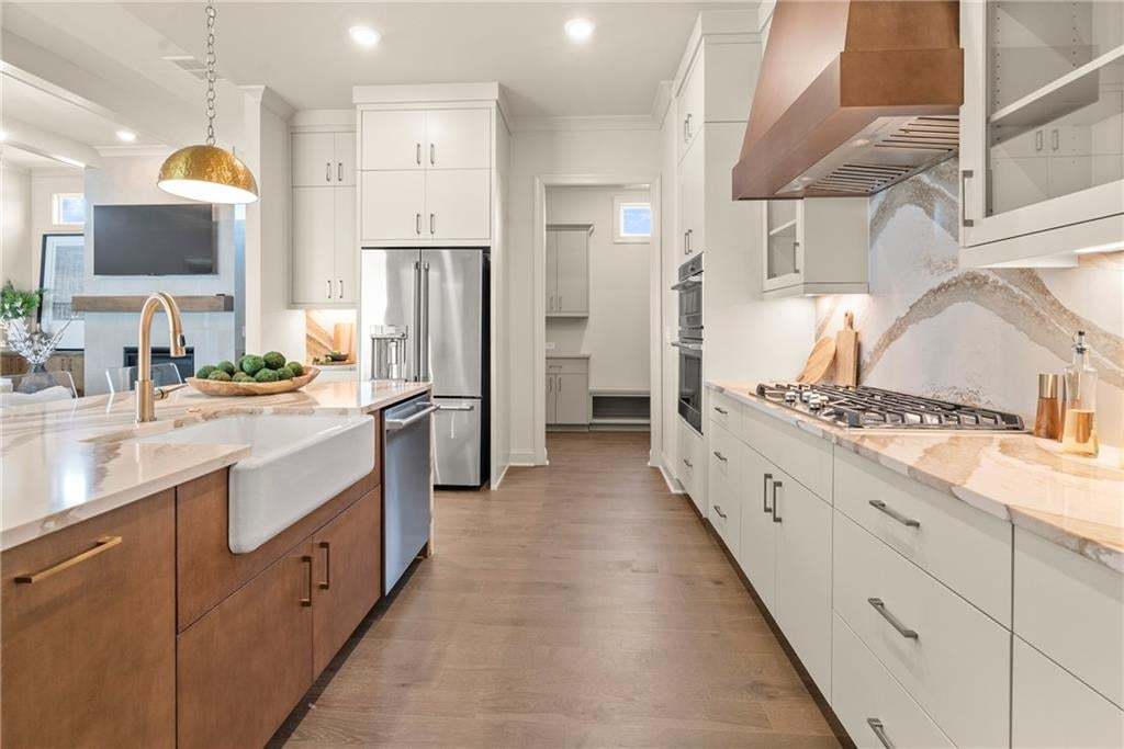The kitchen is the heart of the home and you will definitely feel the love in this Langston home by the Providence Group, located in Hoschton, GA. Photo not of actual home but for representation purposes only.