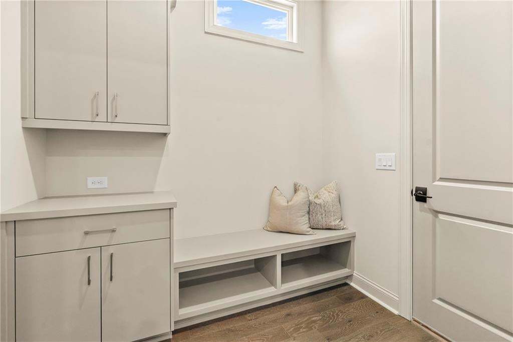 Great mud room drop zone, just when entering the kitchen or garage.  Great extra storage space. Photo not of actual home but for representation purposes only.