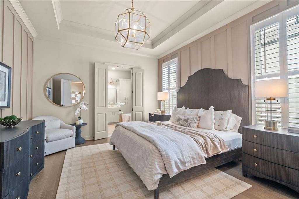The primary bedroom and bath are located in rear of home for extra privacy.  Fitting your king size bed in this space will not be an issue. Photo not of actual home but for representation purposes only.