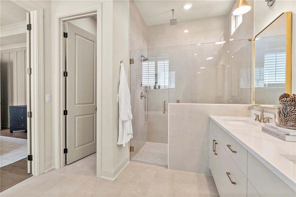 This particular model features both a standalone tub and a shower.  Dual vanities, plenty of storage. Photo not of actual home but for representation purposes only.