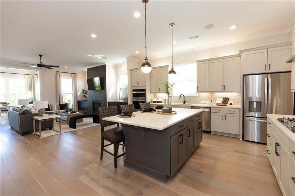 This home is called the Madilyn...this is one you will want to see!!  Photo not of actual home but a previously built TPG home of same plan.