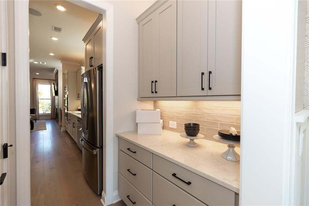 A butlers pantry is ideal for extra storage!!! Photo not of actual home but a previously built TPG home of same plan.