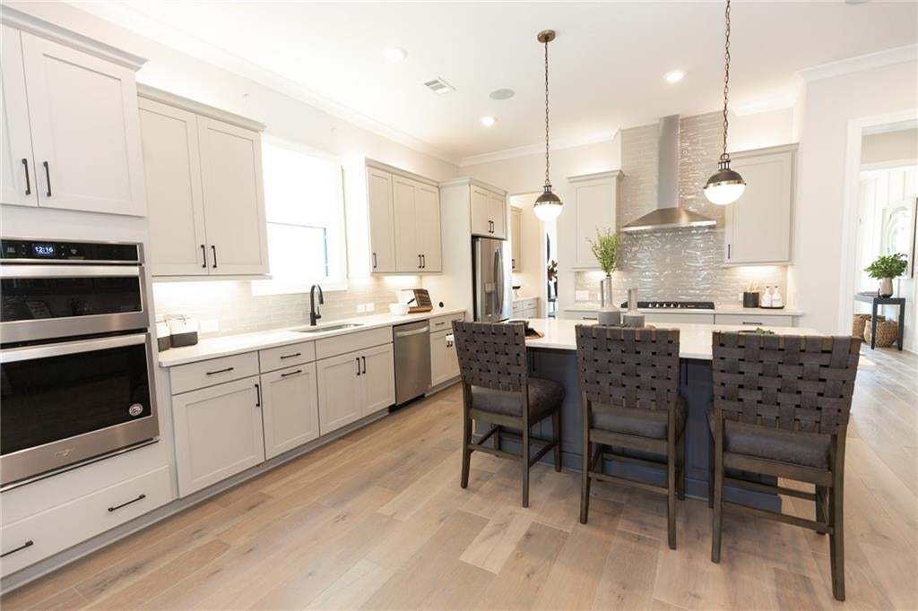 You will love the easy transition from one room to another.  The natural light flows throughout this spacious home. Photo not of actual home but of a previously built Madilyn by TPG.