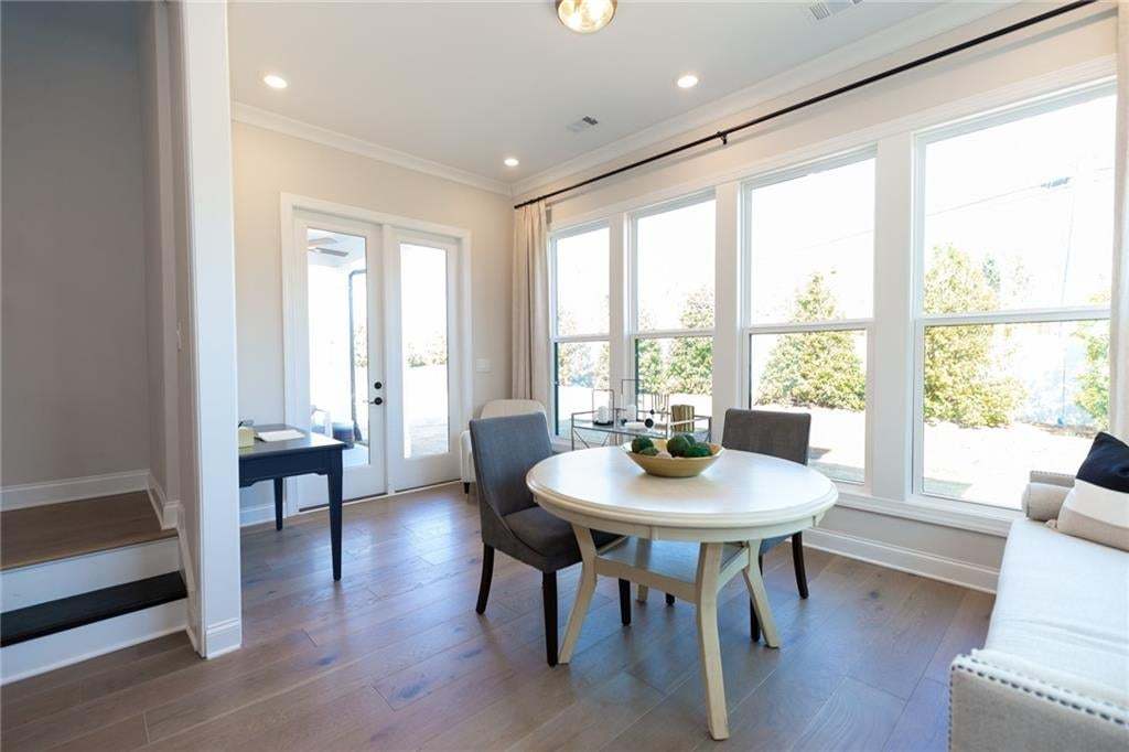 The extra space found in the sunroom just adds so much elegance to this Madilyn floorplan.  You will love the wall of light from all the windows! Photo not of actual home but of a previously built Madilyn by TPG.