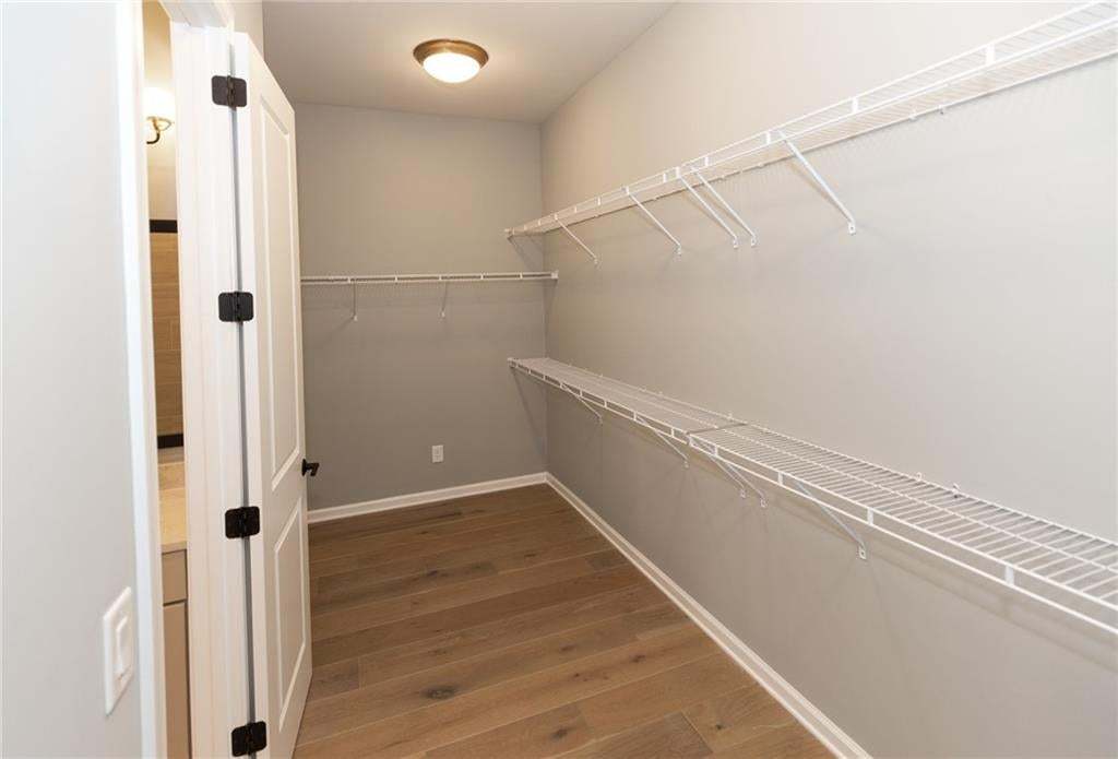 Massive walk-in closet in the primary.  Photo not of actual home but a previously built Madilyn by The Providence Group.