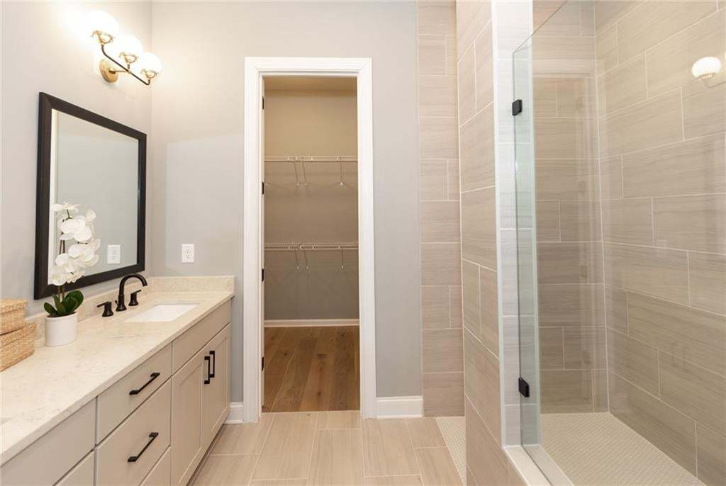 Plenty of storage space in the primary bathroom... Photo not of actual home but a previously built Madilyn by The Providence Group.
