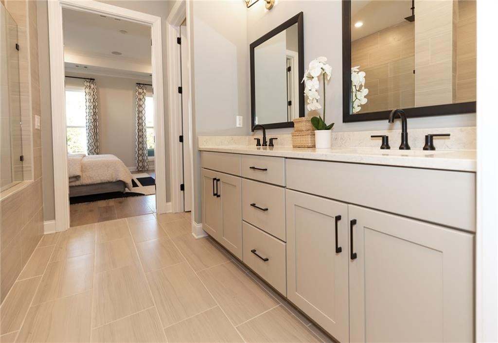 Dual vanity with stone countertops and undermount sinks
